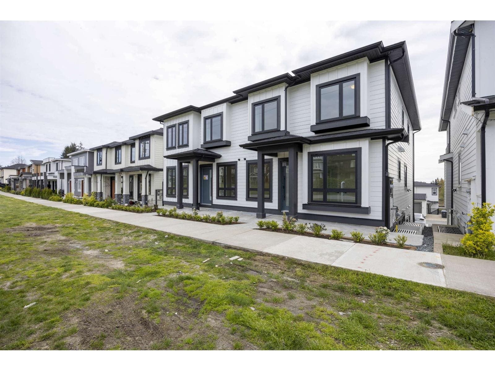 Street elevation of the duplex, seen along the frontage — The Pacific Douglas Duplex